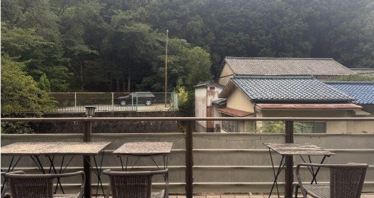 Open-air deck overlooking the forest at Yakuoji-no-Yu Onioso